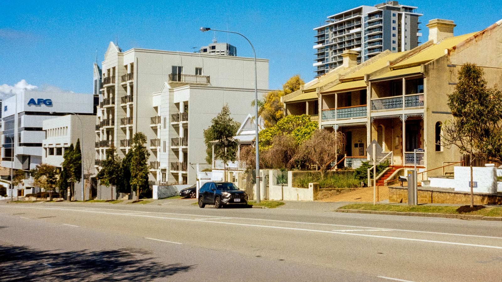 A cinematic street view of the Adelaide city center surrounding the studio location