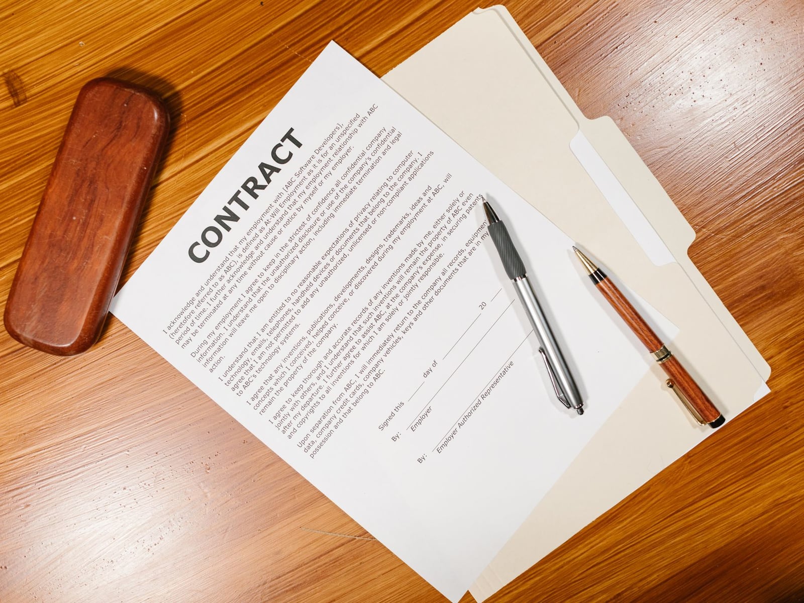 A professional contract and pen on a desk, representing the agreement of master rights